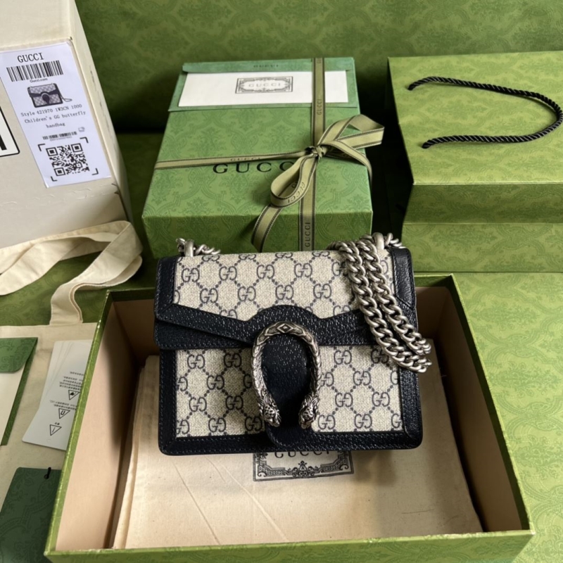 G*u*i clutch bags